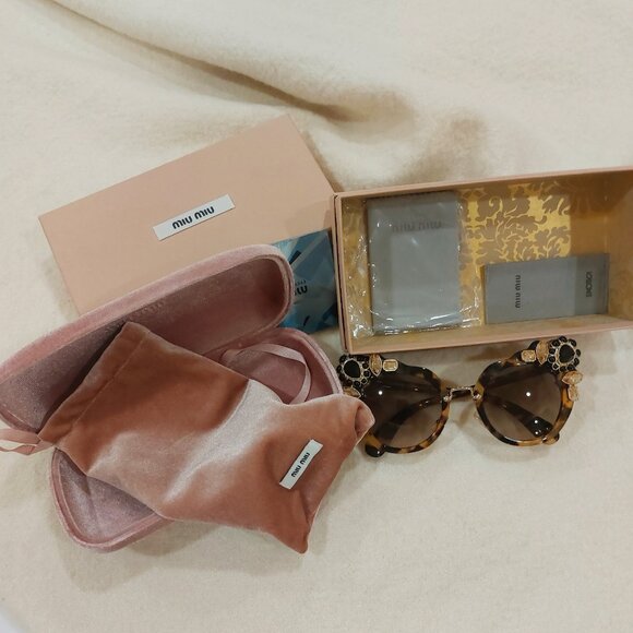 Miu Miu turtoise Sunglasses - Picture 2 of 4